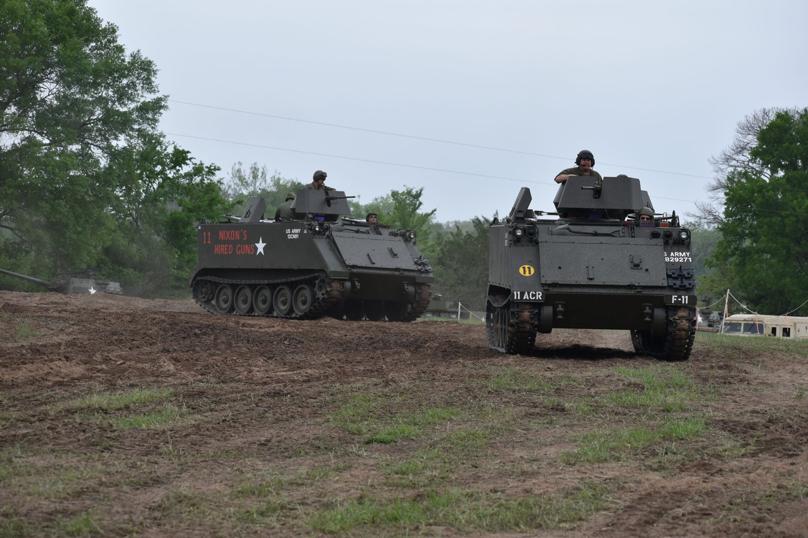 A pair of M113 APCs rolling up